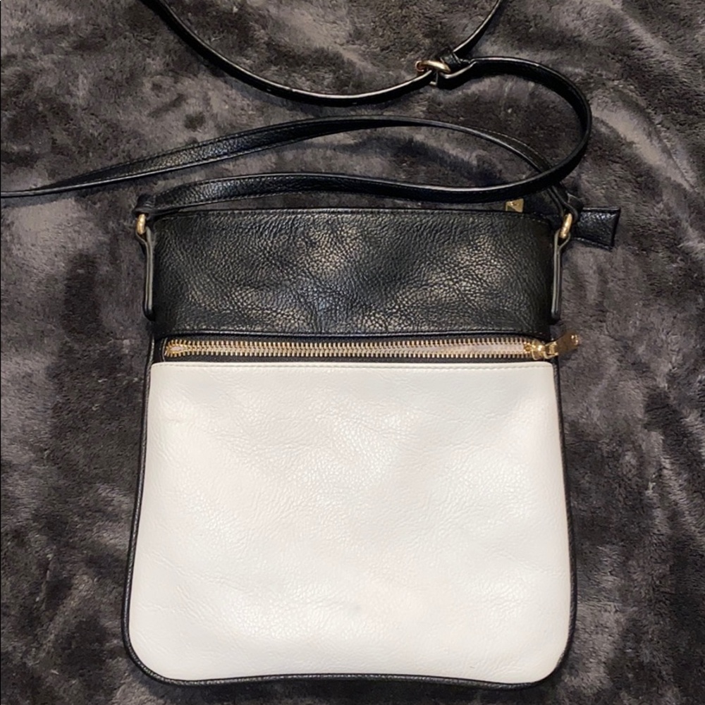 A charming charlie’s black and white shoulder bag